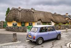 Ireland 2017 - Classic Car Road Trip Ireland: Our own Mini Authi in front of a row of traditional thatched roofed cottages in the village of Adare in County...