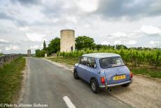 Portugal - Classic Car Road Trip: Driving a classic Mini through the landscape of the Saint-Émilion wine region, a part of the Bordeaux wine...