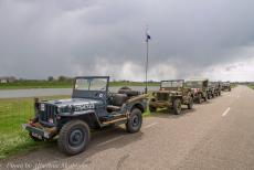 Commemoration Operation Quick Anger 2019 - Operation Quick Anger Commemoration 2019: Dark clouds hover over a convoy of WWII Jeeps. These vehicles had gathered on the dyke road near... Commemoration Operation Quick Anger 2019 - Operation Quick Anger Commemoration 2019: Dark clouds hover over a convoy of WWII Jeeps. These vehicles had gathered on the dyke road near...