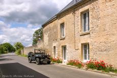 Normandy, 75 years after D-Day - A memorial tour through Normandy during the 75th anniversary of D-Day: Our Ford GPW Jeep in front of&nbsp;a row of traditional French houses in a...