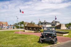Normandy, 75 years after D-Day - Travelling in a Ford GPW Jeep through Normandy: Our Jeep in front of a Sexton self-propelled gun at Ver-sur-Mer. The Sexton was a gift to the...