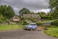 IMM 2019 Bristol - Classic Car Road Trip: In our own Mini Authi driving through the ford on the river Eye in Upper Slaughter. The village is built on both...