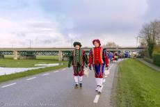 Arrival of Sinterklaas - Arrival of Sinterklaas in a 1942 Ford GPW Jeep: November 2023, two Sooty Piets on a dyke road along the river IJssel. Sooty Piets are dressed...