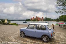 Lithuania 2015 - Classic Car Road Trip: The classic Mini in front of Trakai Castle. The castle is located in the Town of Trakai, 28 km west of Vilnius, the...