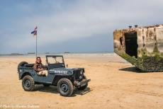 Normandy 2009 - Classic Car Road Trip Normandy: Driving in our own 1942 Ford GPW Jeep along Gold Beach at Arromanches-les-Bains, the remains...